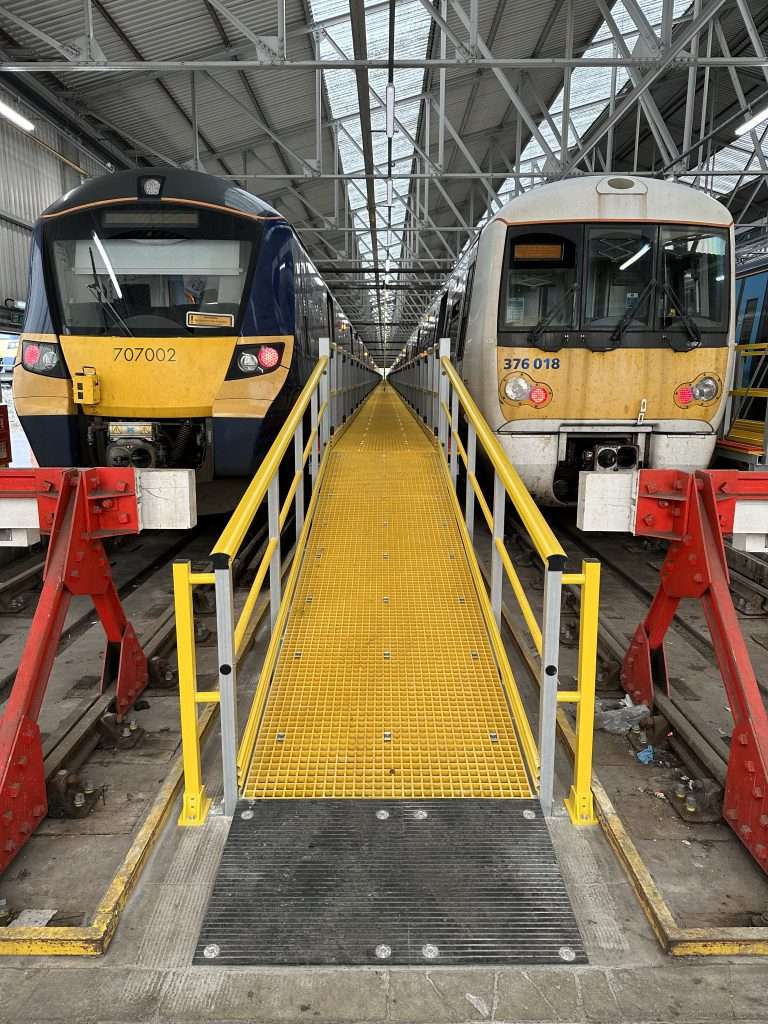 Glass reinforced Plastic ramp with handrails used for train access